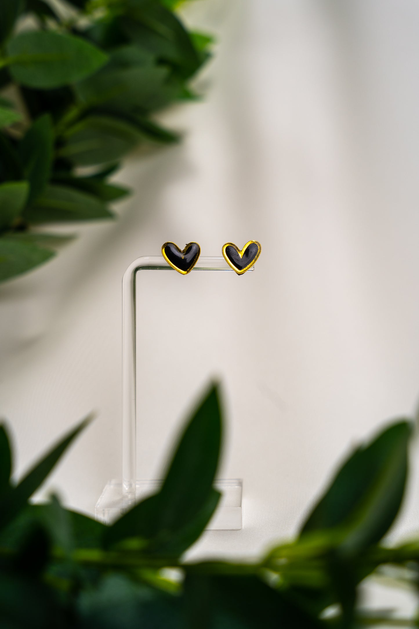 Black heart studs with gold outline