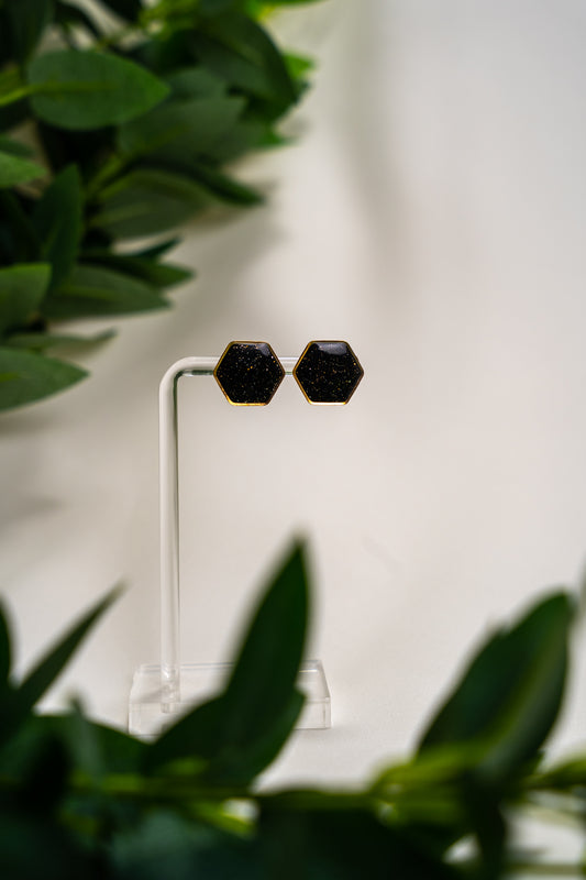 Black sparkly studs with gold detail (round or hexagon)